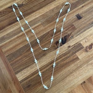 Pearl and bead long necklace.